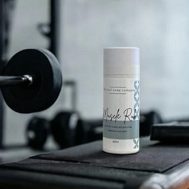 Old Soul Soap Company natural muscle rub in 2 oz clear glass jar with white lid, infused with essential oil blend, textured