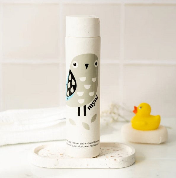 Close-up of the myni 3-in-1 Kids Starter Kit shampoo bottle showing vibrant label details and playful design elements.