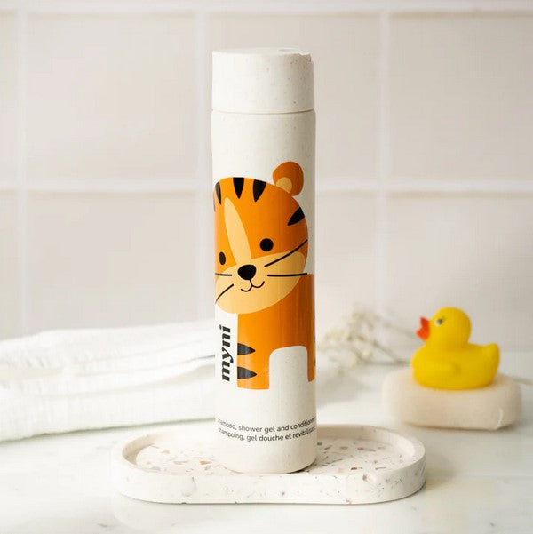 Close-up of the Myni Kids Starter Kit shampoo bottle tip, highlighting the gentle applicator and playful label design with