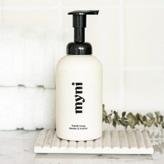 Close-up of the Myni Foaming Hand Soap Kit label showing vibrant color and textured pump mechanism detail