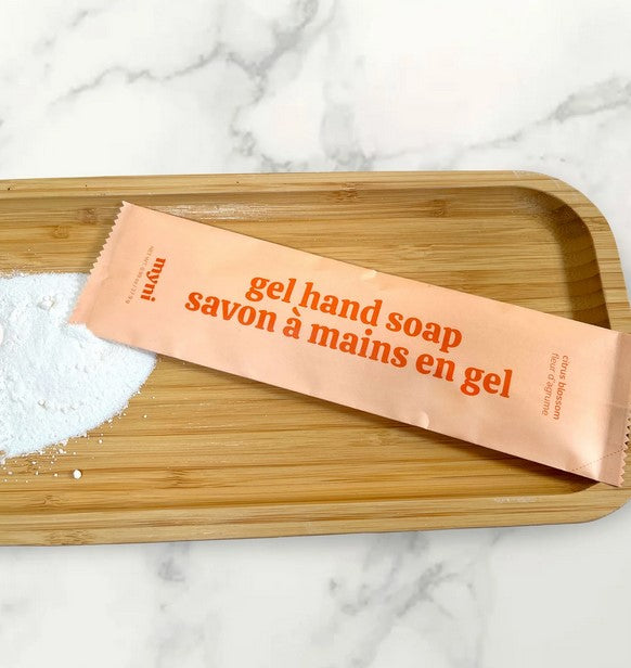 Close-up of the transparent powder-to-gel refill pouch showing textured surface and bright green color detail.