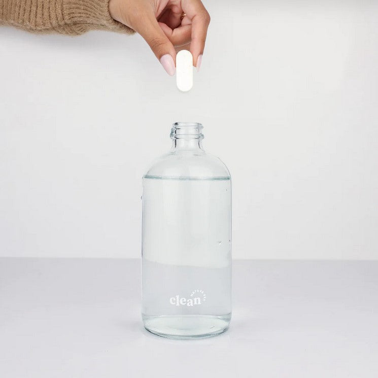 Close-up of the spray nozzle and citrus-scented mist emitting from the Nature Bee Honey Clementine Multi-Purpose Spray Kit