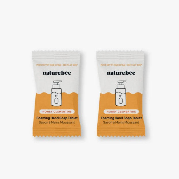 Close-up of the foaming hand soap tablet's textured surface with bright citrus scent label visible from a top-down