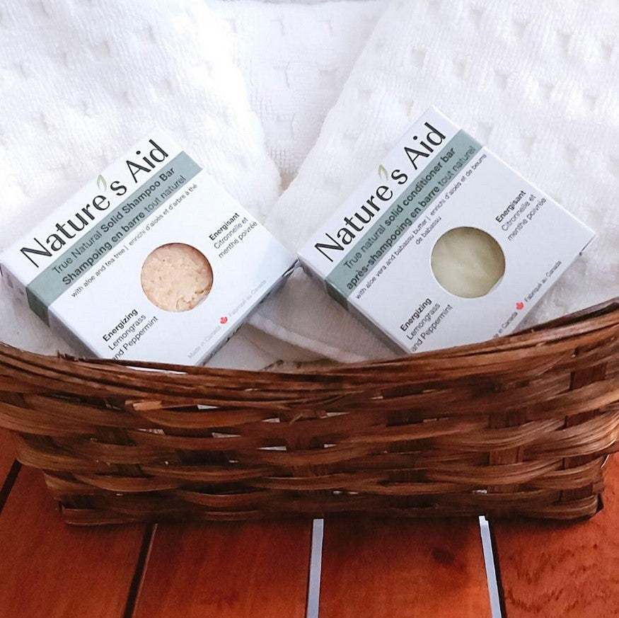 Close-up of textured, natural lemongrass and peppermint ingredients embedded in the shampoo bar’s surface, highlighting its