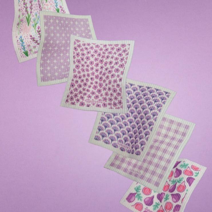 Close-up of the textured purple sponge surface showcasing absorbent fibers and intricate weave pattern from a top-down angle.