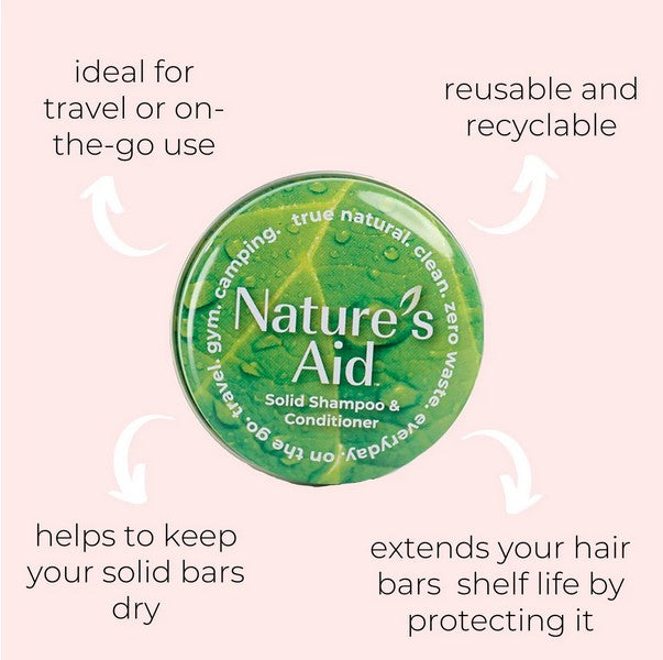 Close-up of the black travel tins with clear white labels and textured matte finish for the shampoo and conditioner bars