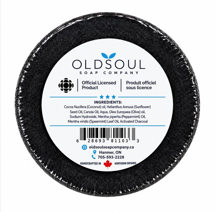 Back of officially licensed Hockey Night in Canada black puck soap by Old Soul Soap Company, showing ingredient list, product label and Canadian-made details.