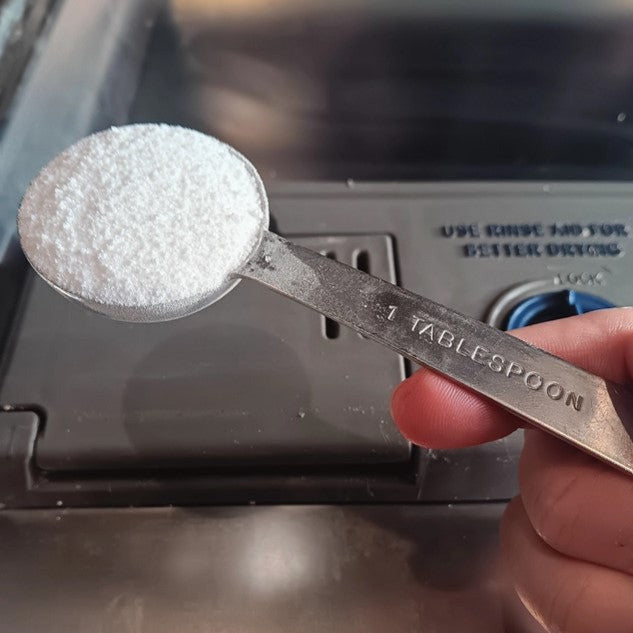 Close-up of Earthly Change dishwasher detergent label highlighting eco-friendly ingredients and branding details