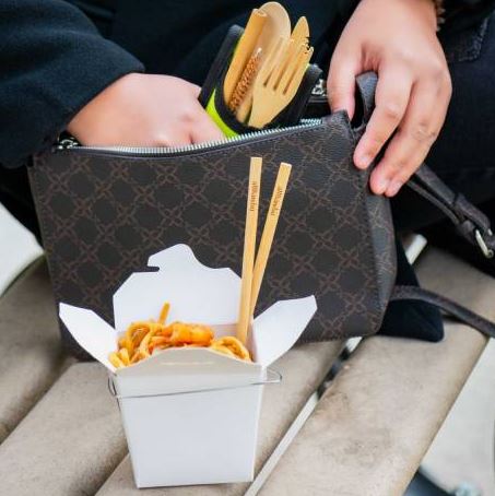 Close-up of bamboo utensil handles showcasing smooth finish and natural wood grain details