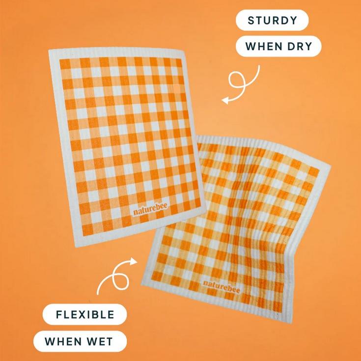 Close-up of the textured orange sponge surface with visible pores and crisp edges, highlighting its absorbent material