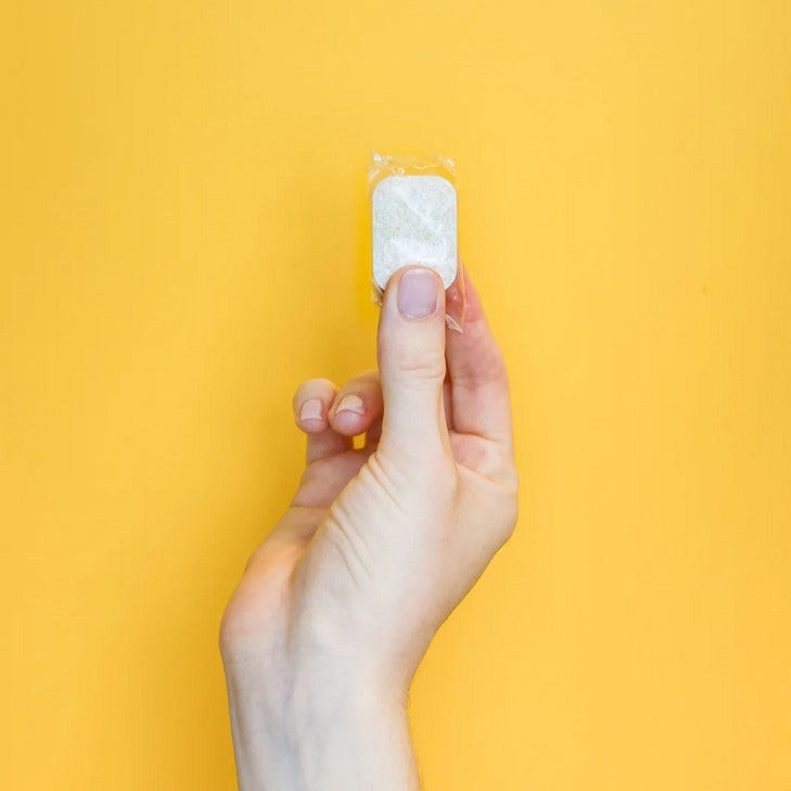 Close-up of Nature Bee Dishwasher Tablets packaging highlighting eco-friendly label and distinctive leaf logo design.