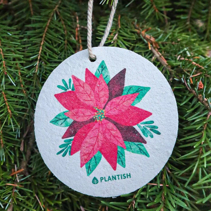 Close-up of the Botanical Bliss sponge set revealing textured surface and vibrant botanical print detail from an angled