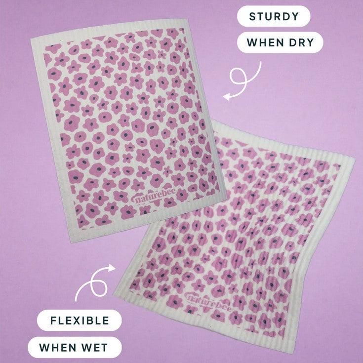 Close-up of the purple sponge's textured surface highlighting its absorbent, eco-friendly material and detailed floral