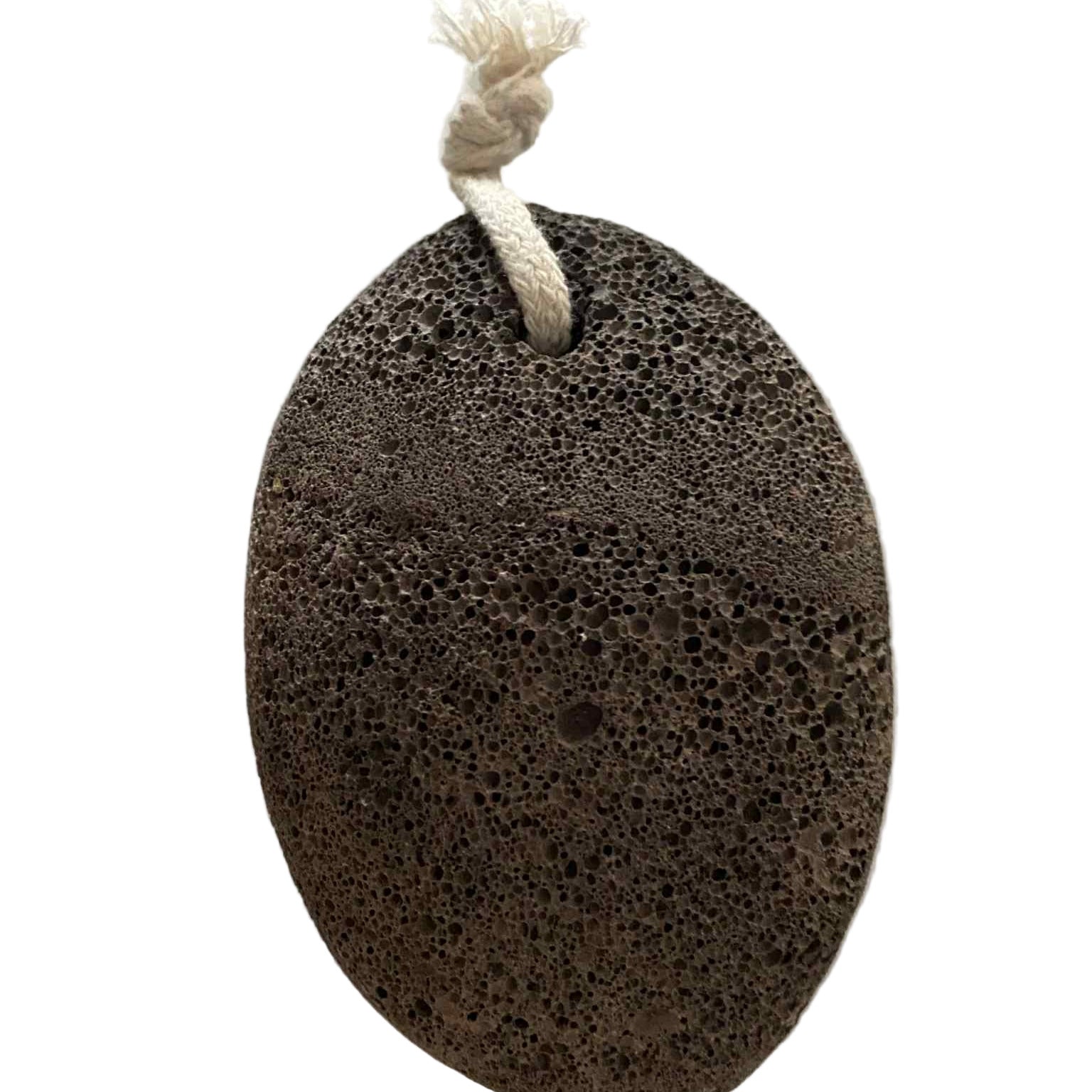 Close-up of porous volcanic lava pumice stone revealing natural texture and tiny mineral inclusions on a clean surface.