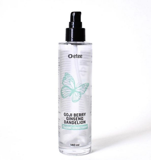 Close-up of facial cleanser concentrate tube displaying textured label and precise product name on sleek packaging