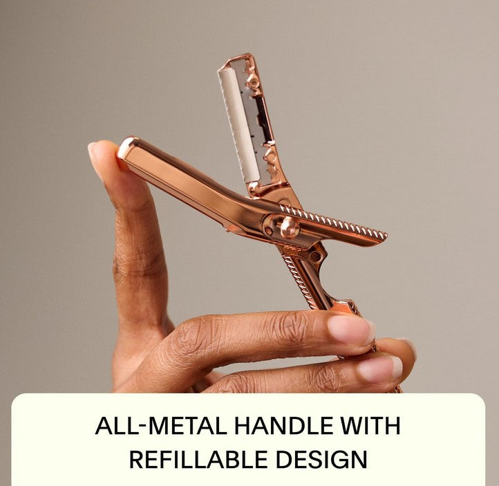 Close-up of the Mercury Leaf Dermaplaner blade with textured stainless steel surface and precise edge detail from an