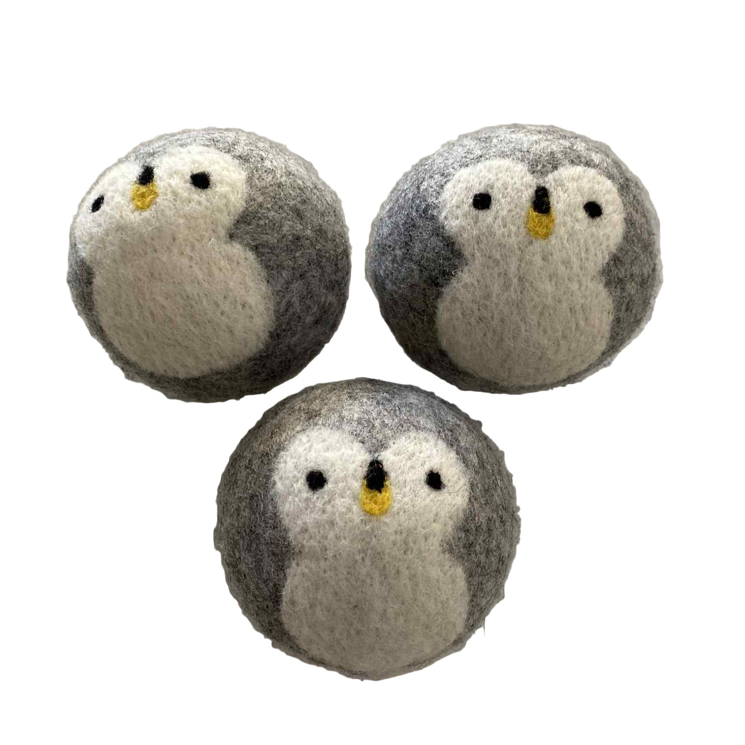 Close-up of the textured surface of Penguin Wool Dryer Ball showcasing its hand-crafted, natural wool fibers in soft, earthy