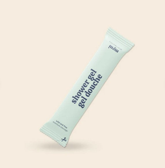 Close-up of Myni Shower Gel bottle label highlighting organic, farm-raised ingredients and eco-friendly design detail