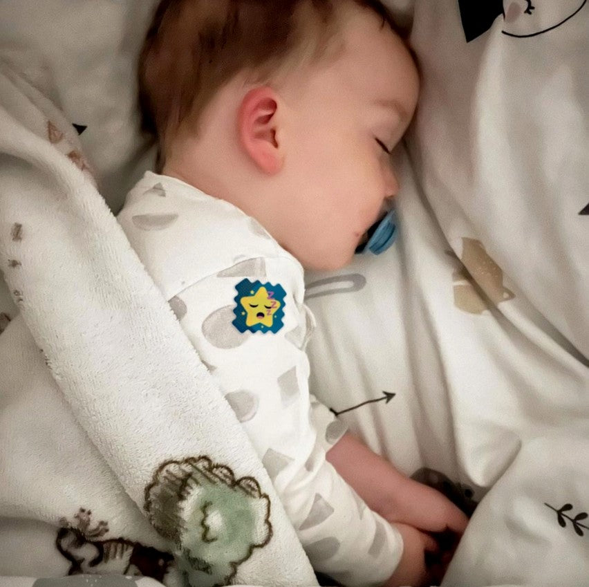 Close-up of NATPAT Sleep Stickers packaging highlighting colorful, playful design and textured paper material details.