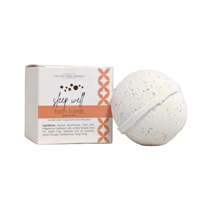 Old Soul Soap Company Sleep Well Bath Bomb, round and unwrapped beside the box on a white background