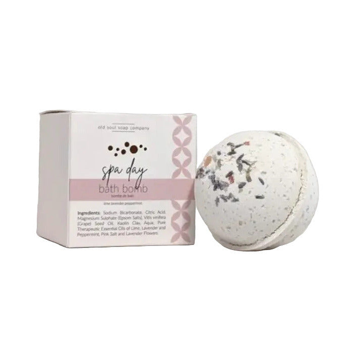 Old Soul Soap Company Spa Day Bath Bomb, round and unwrapped beside the box on a white background