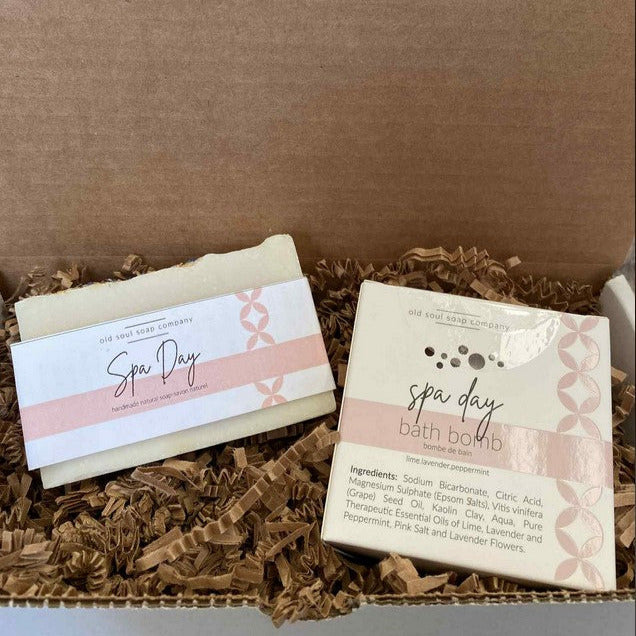 Old Soul Soap Company Spa Day Gift Set with white bath bombs, natural loofah, and eucalyptus-scented shower gel in a green