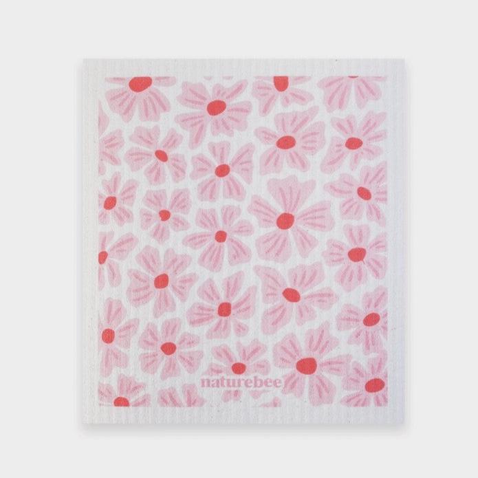 Close-up of the Pink Nature Bee Sponge Cloth's textured surface with visible honeybee pattern detail on the fabric edge.