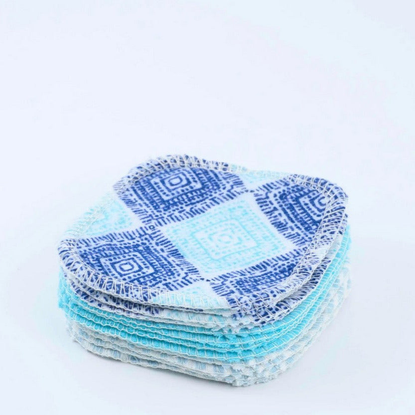 Close-up of the Seaside-themed embroidery detail on the reusable facial round with textured terry cloth surface