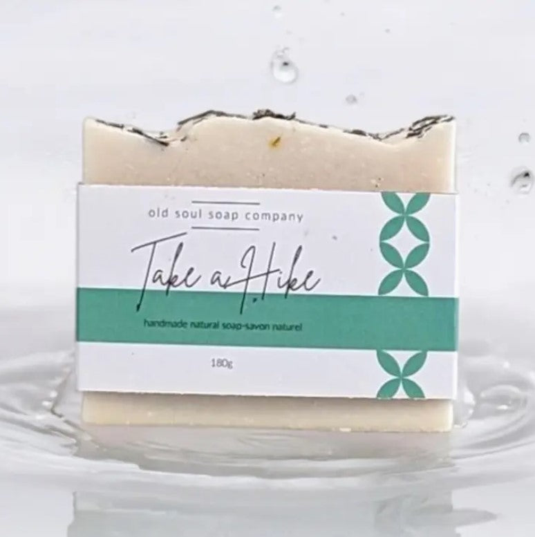 Handcrafted artisan soap bar with natural essential oils, textured surface, and rustic packaging from Old Soul Soap Company