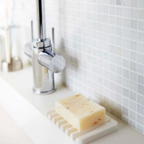 Close-up of the silicone soap tray’s textured surface and raised edges, highlighting its flexible, non-slip material and