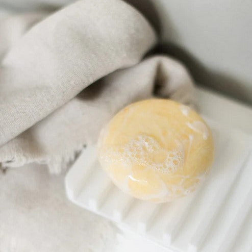 Close-up of silicone soap tray’s textured surface and curved edges, highlighting its water drainage design and flexible