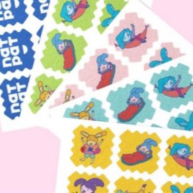 NATPAT Kids Tick Repellent Stickers featuring colorful cartoon animals on a white adhesive sheet, chemical-free and suitable