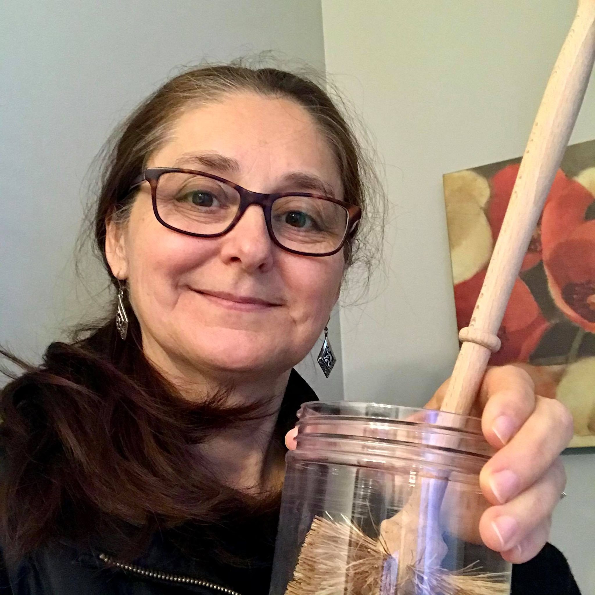 Close-up of biodegradable bristle texture and eco-friendly handle detail on the compostable toilet brush from a top-down