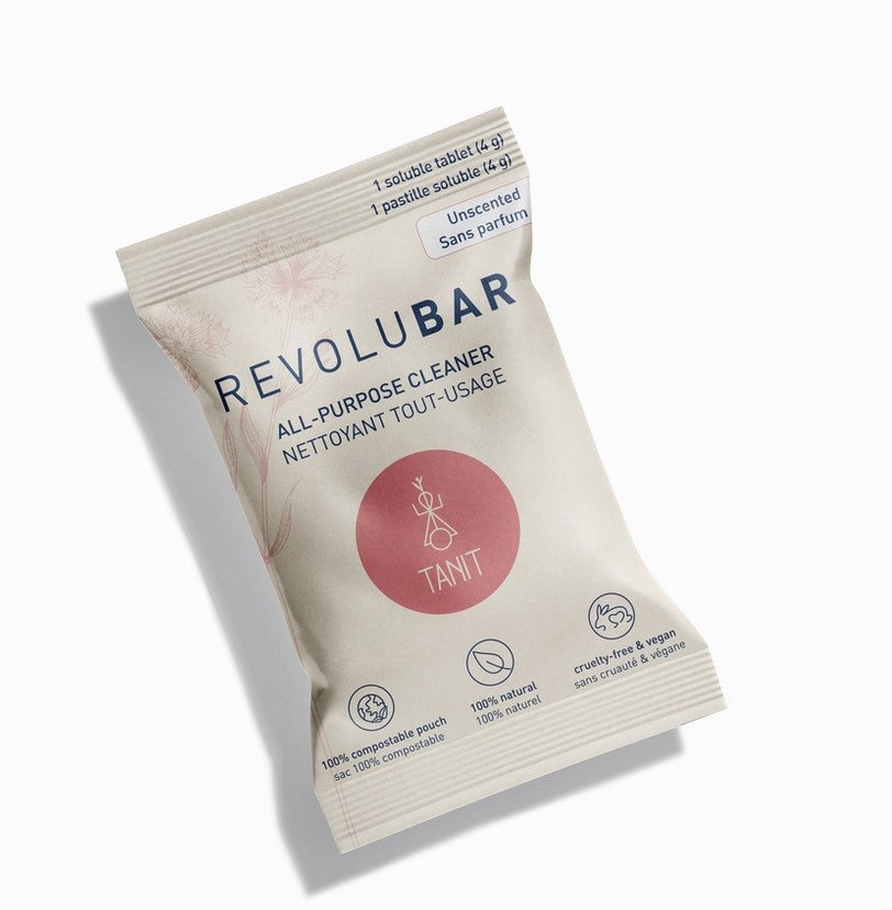 Revolubar All Purpose Spray Cleaner Tablet in biodegradable packaging on kitchen countertop, compact size, made in Canada
