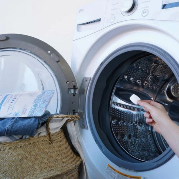 Close-up of Revolubar detergent tablets showing textured surface and embossed branding on individual pieces
