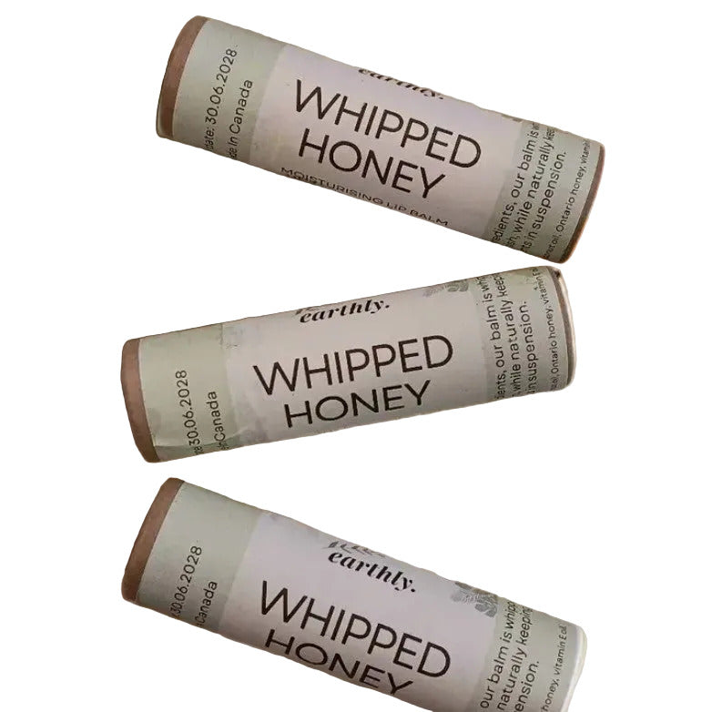 Plastic-free whipped honey lip balm by Earthly Change made in Canada, cardboard tube lip balm with Ontario honey on a white background