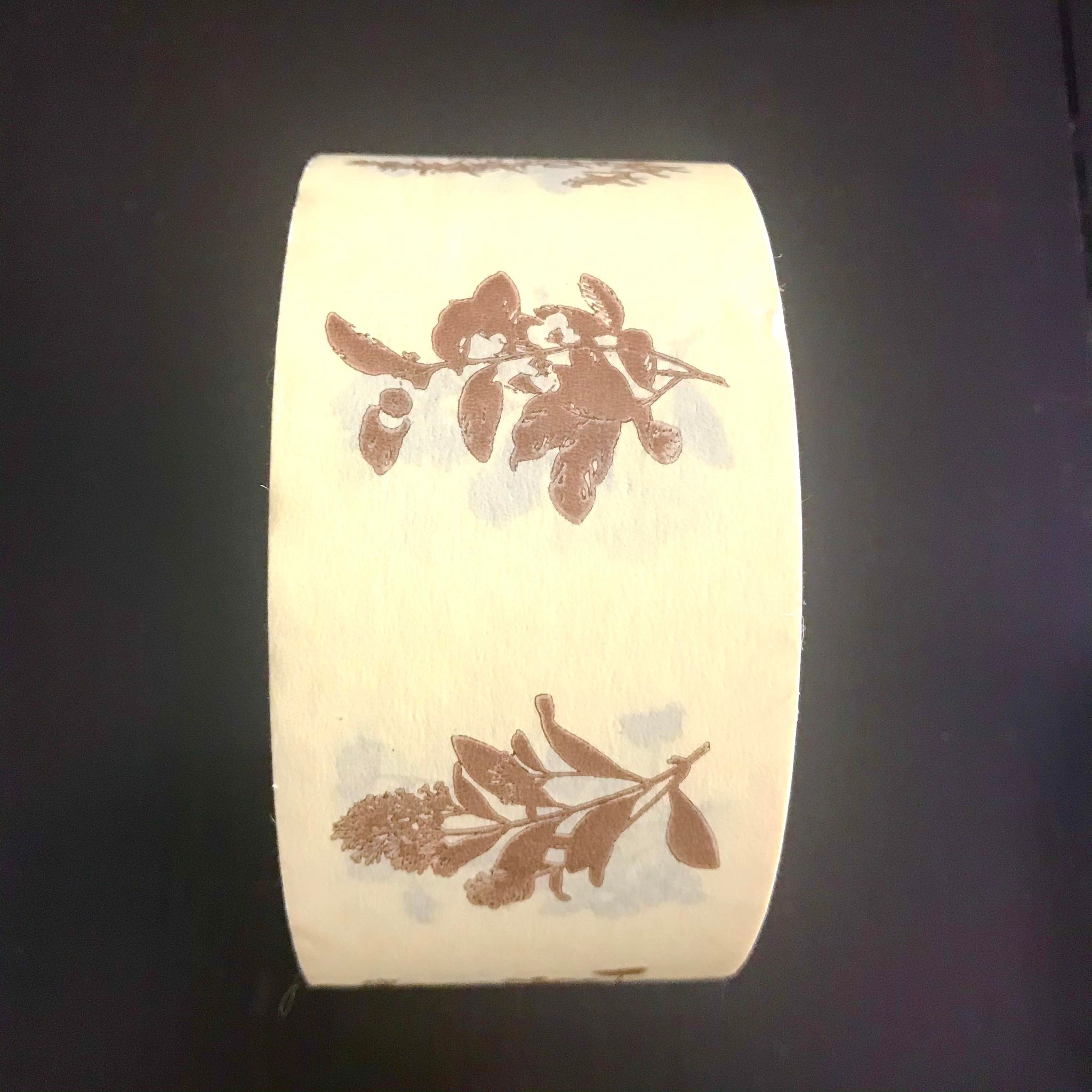 Close-up of eco-friendly paper tape’s textured surface and natural kraft finish, showing its adhesive backing for seamless