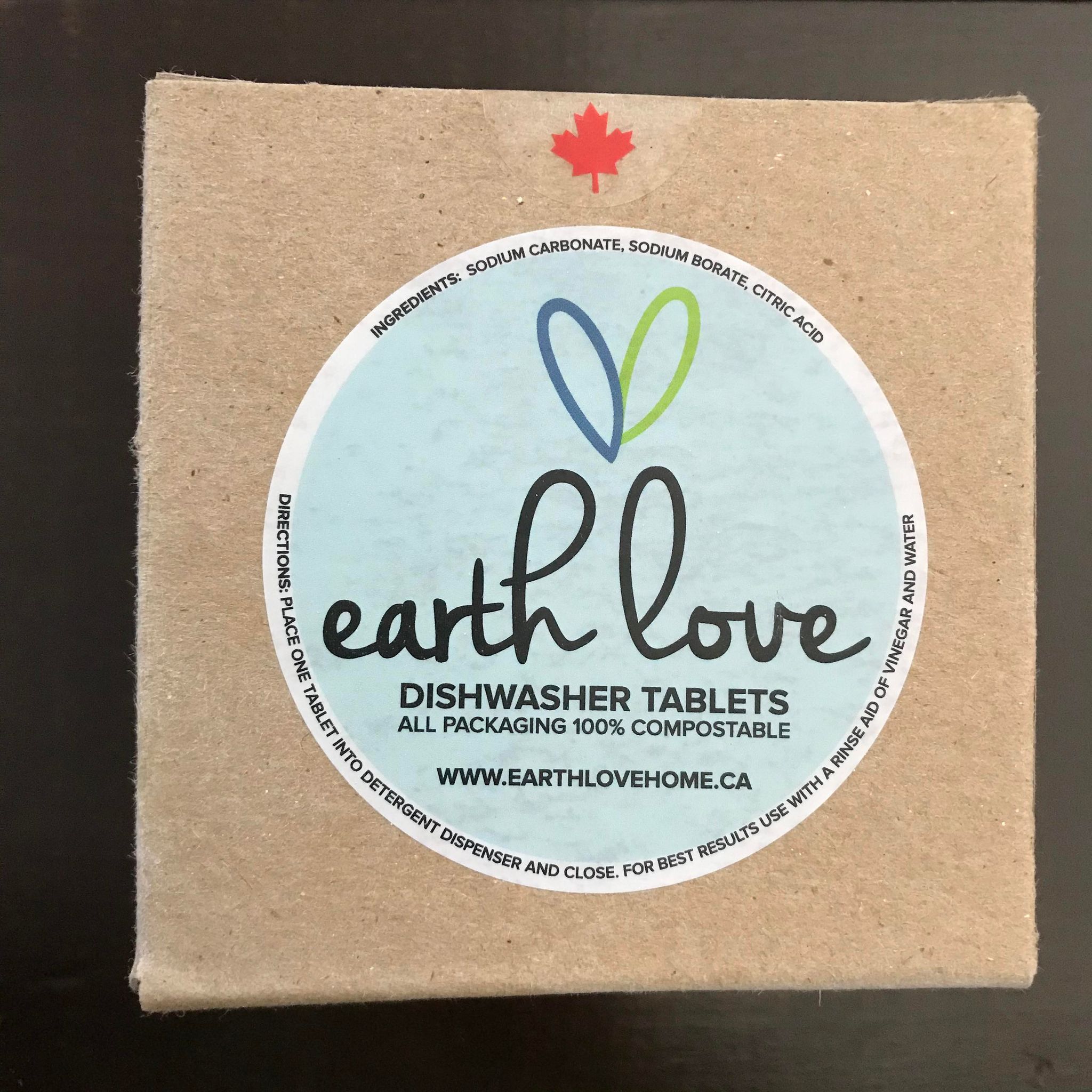 Close-up of Earth Love Dishwasher Tablets packaging highlighting eco-friendly logo and textured label surface