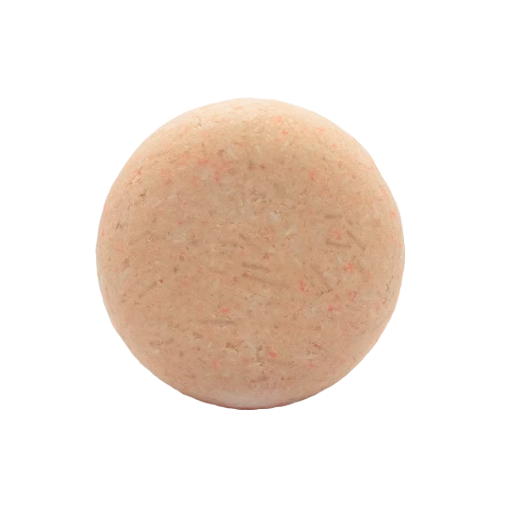 Close-up of the Good Juju Shampoo Bar’s textured surface with visible natural ingredients and subtle scent notes.