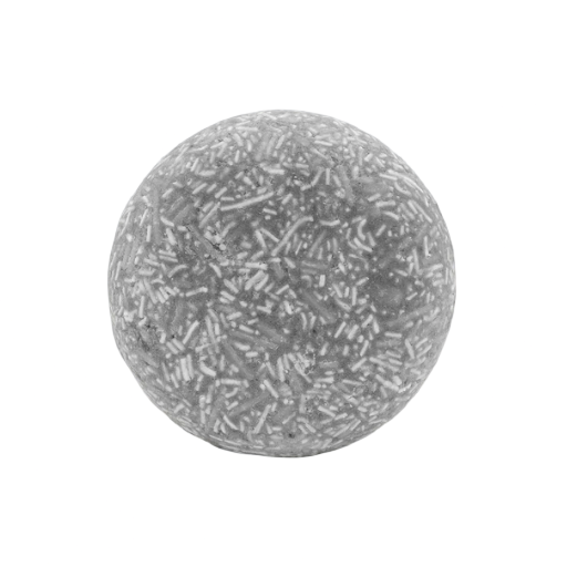 Close-up of the Good Juju Scalp Care Shampoo Bar's textured surface showcasing herbal ingredients and subtle scent hints