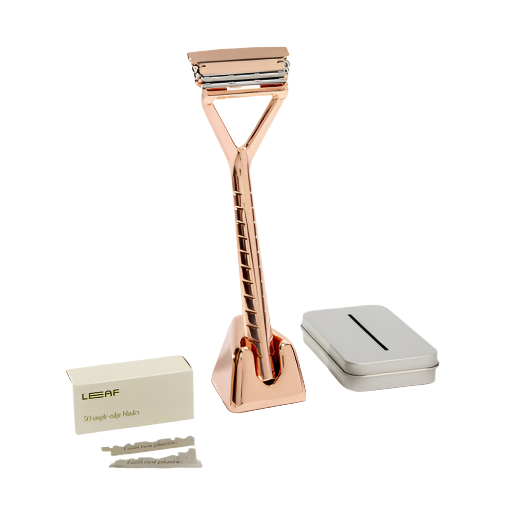 Leaf Razor Kit in rose gold with stainless steel razor handle, ergonomic textured grip, and protective lid in a sleek bundle