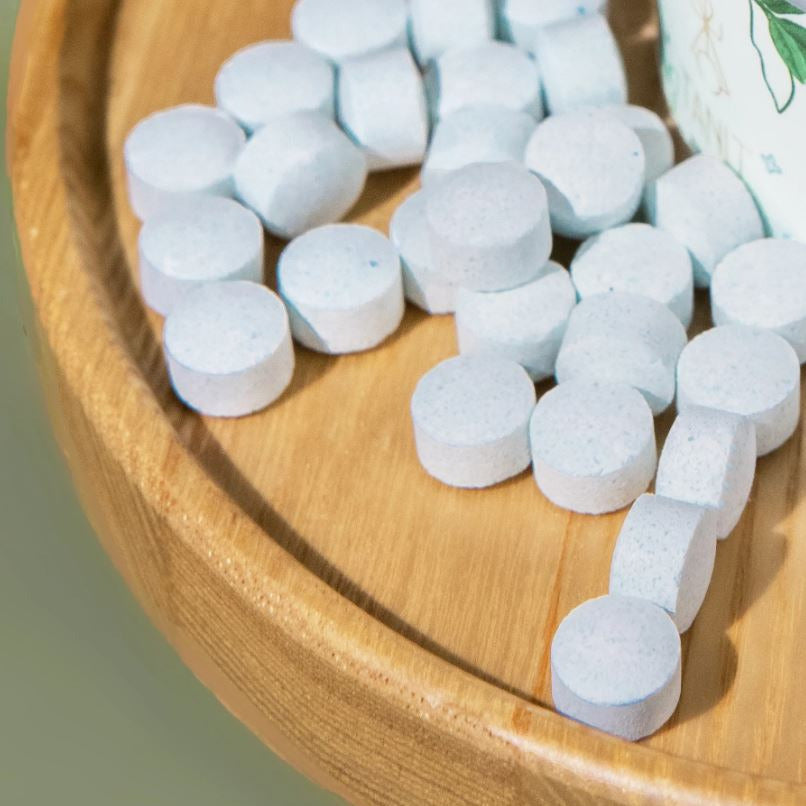 Close-up of TANIT Mouthwash Tablets container showing textured label with dosage instructions and eco-friendly design