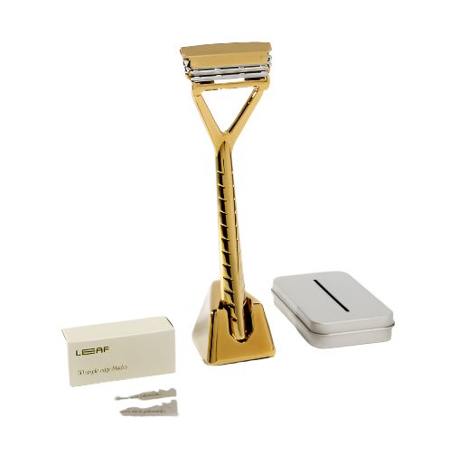 Leaf Gold Razor Kit with textured gold aluminum handle and stainless steel razor blades, in sleek black packaging