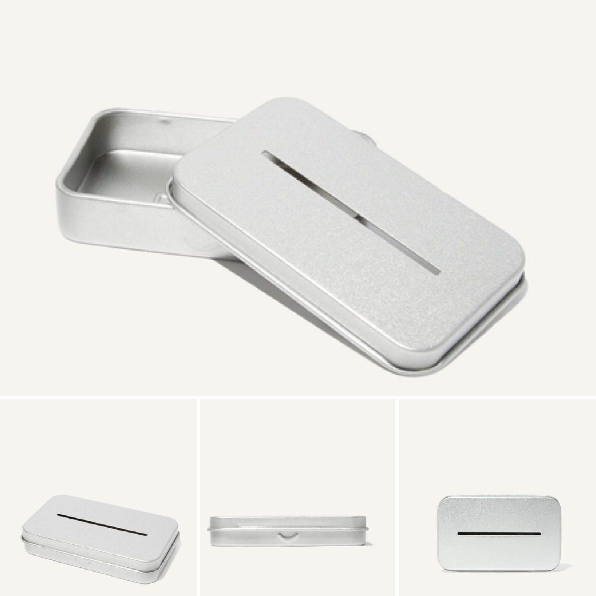 Close-up of the Leaf Blade Recycling Tin’s engraved logo and subtle embossed leaf pattern on its textured metal surface.