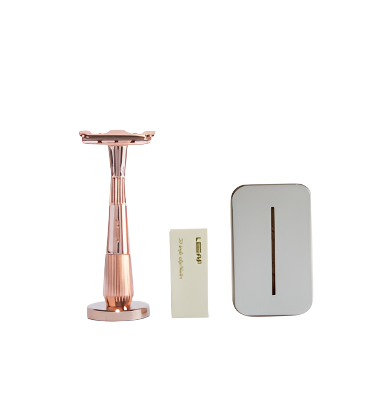 Leaf Shave Twig Razor Kit in rose gold with textured aluminum handle and leaf-shaped razor head on white background