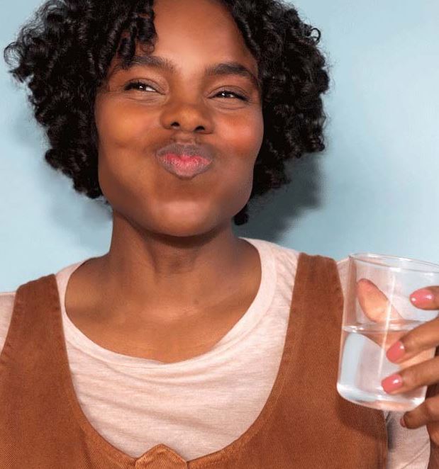 Close-up of TANIT Mouthwash Tablets container lid revealing textured ridges and clear labeling detail on a white surface.