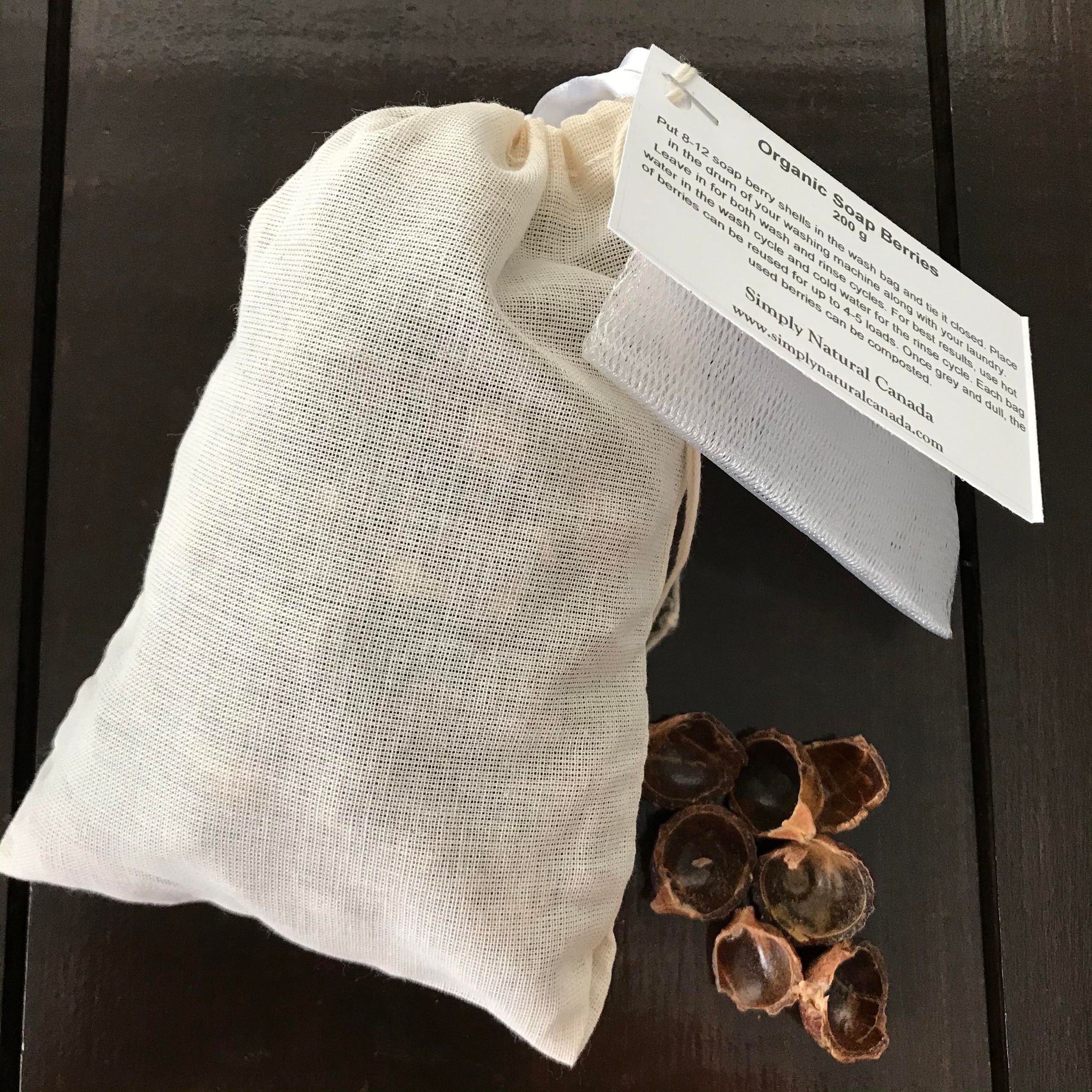 Organic soapberries in a biodegradable bag with Simply Natural Canada branding, eco-friendly laundry essential for gentle