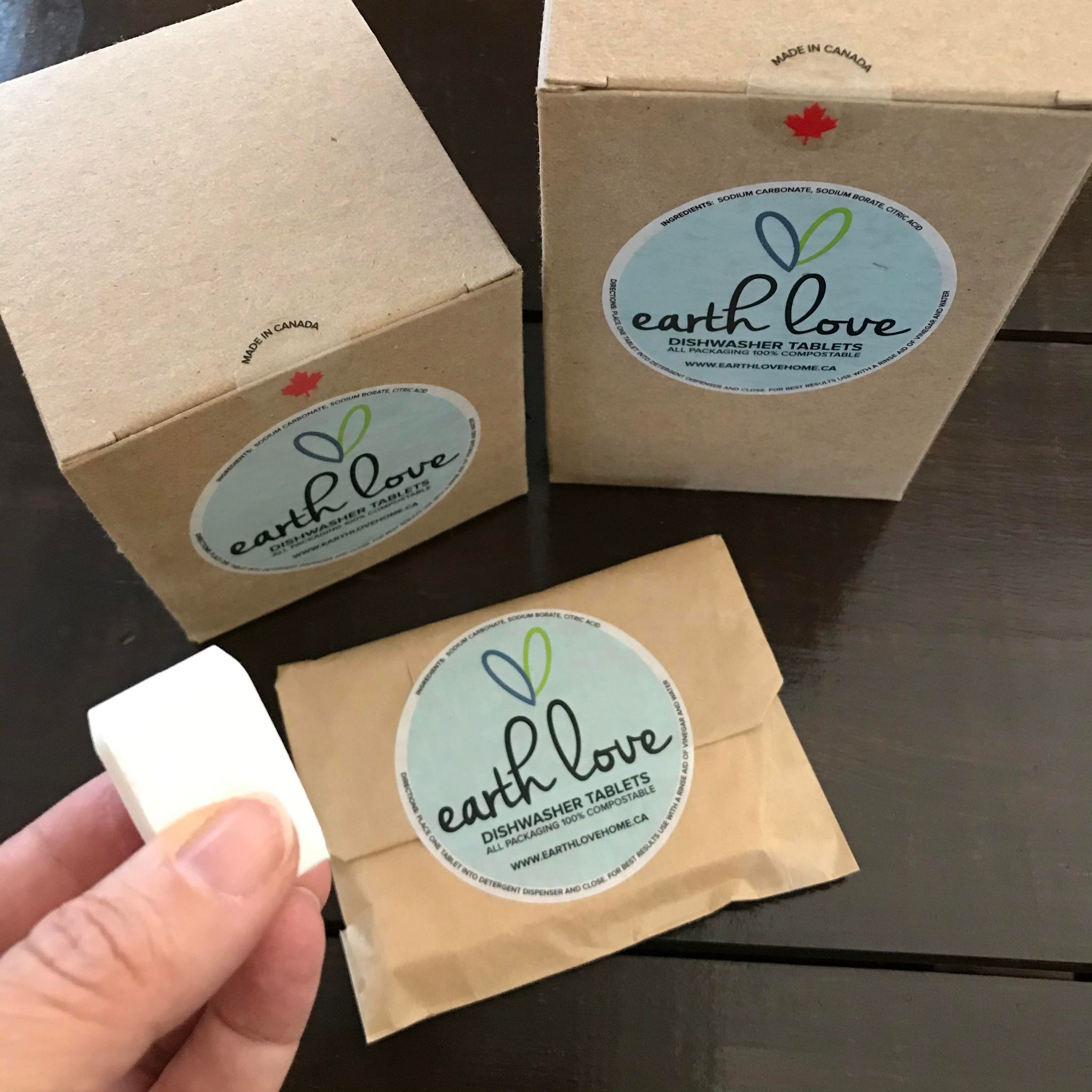 Close-up of Earth Love Dishwasher Tablets packaging displaying eco-friendly label and natural fiber wrapping