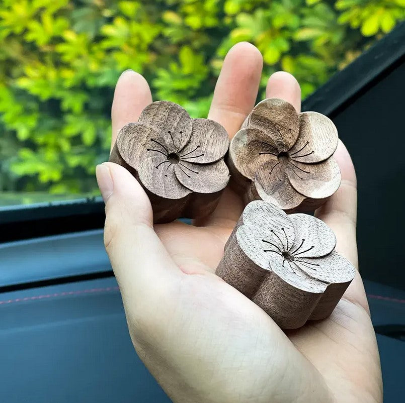 Plantish car essential oil diffuser in light wood finish with adjustable airflow and integrated USB charging port