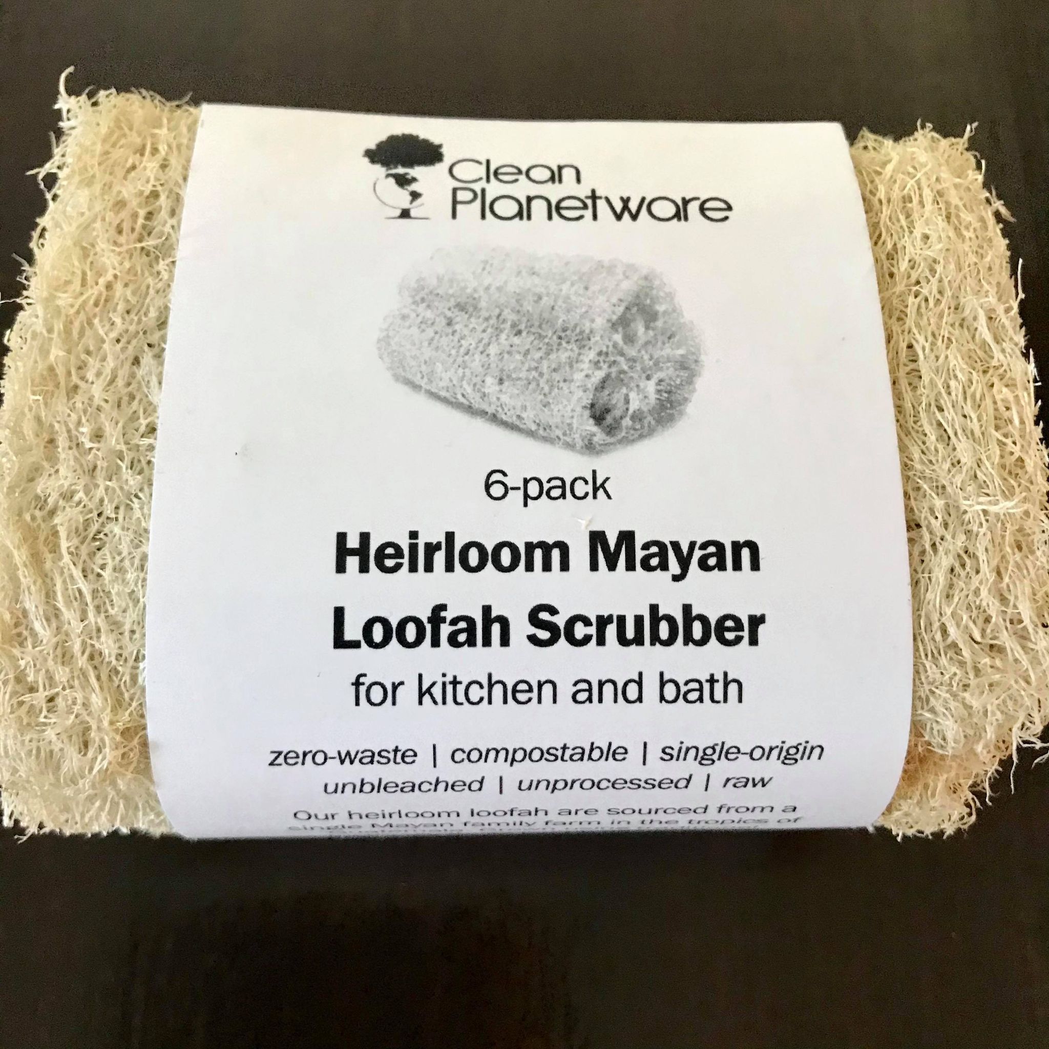 Close-up of natural loofah fibers highlighting coarse texture and fibrous detail for exfoliation.